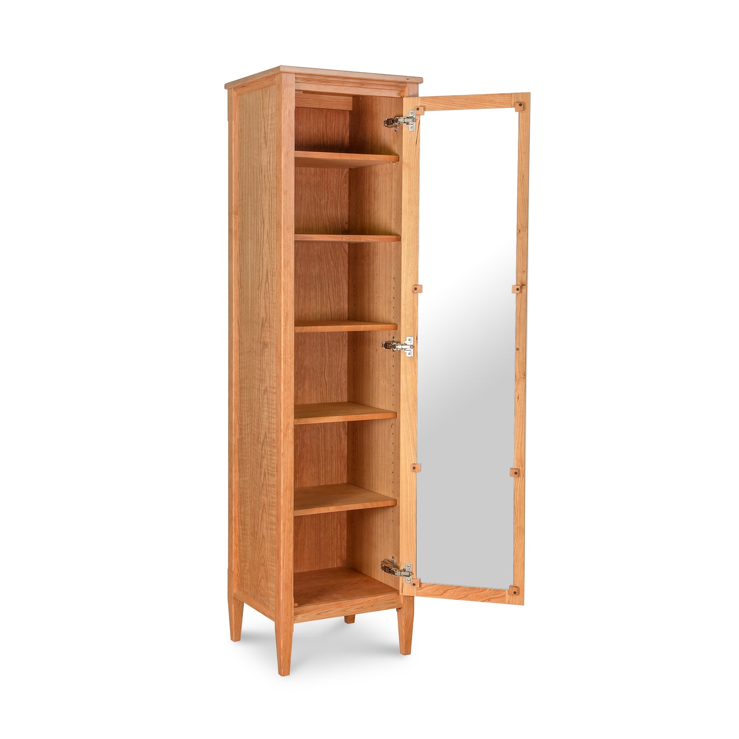 A solid wood bookcase resembling a Maple Corner Woodworks Vermont Shaker Narrow Bookcase with Mirror, with an open door, revealing four empty shelves, isolated on a white background.