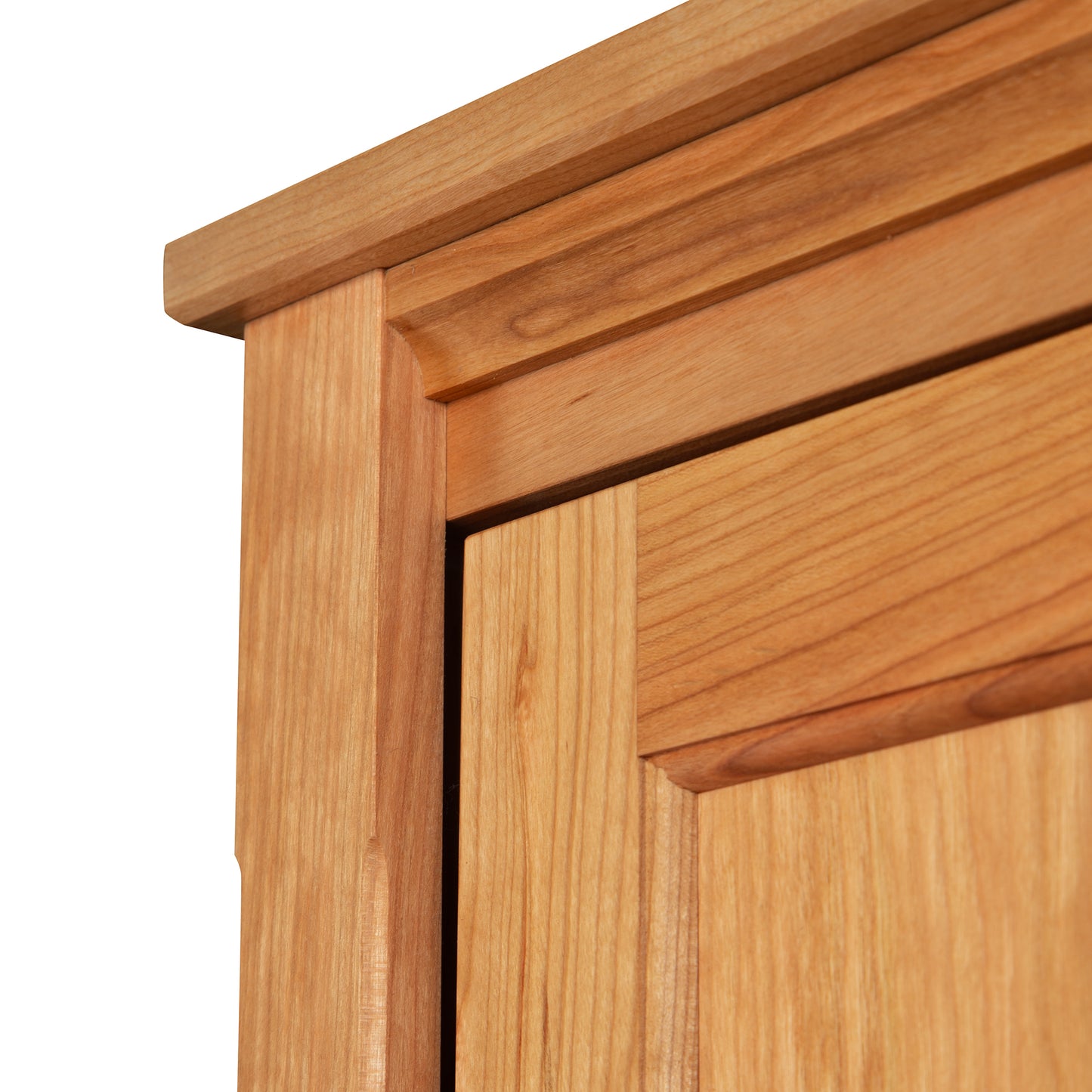 Maple Corner Woodworks bookcase corner highlighting detailed joinery in natural cherry hardwood.