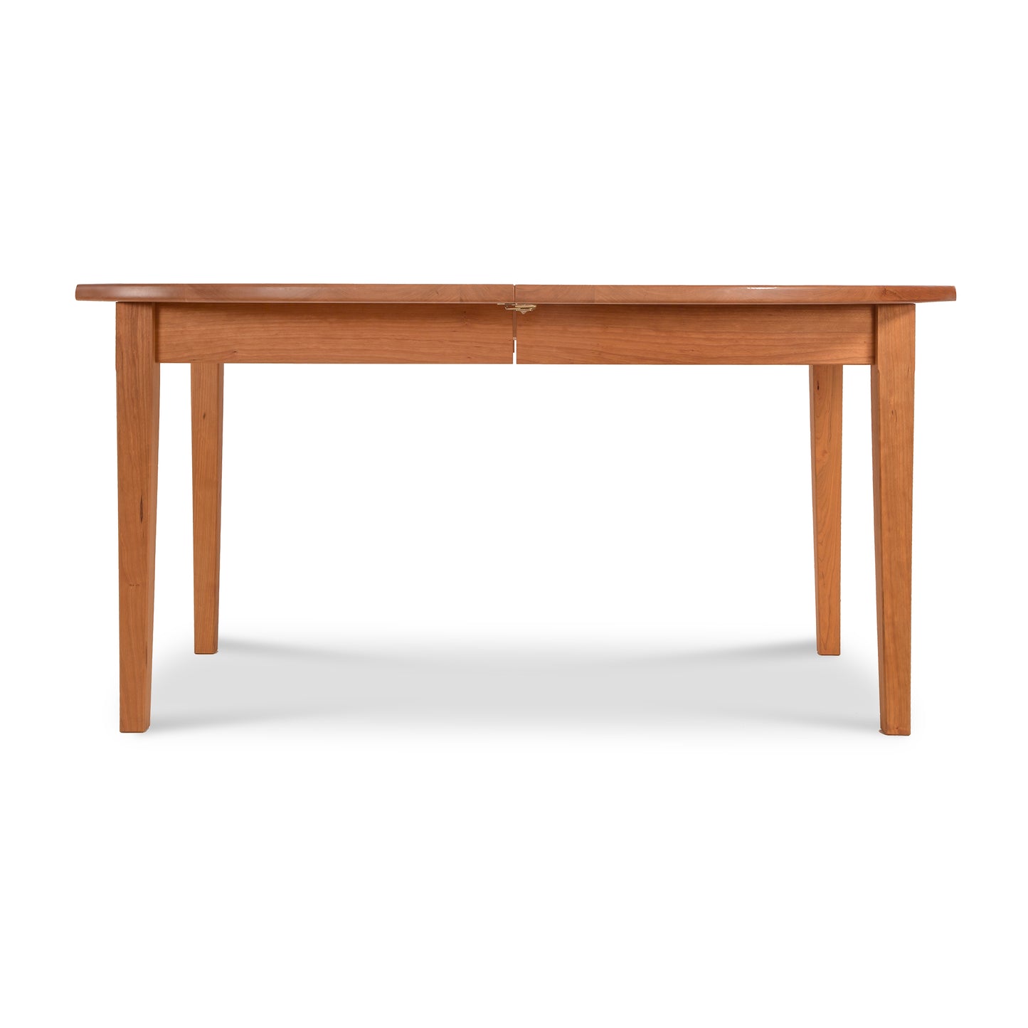 Vermont Shaker Oval Extension Dining Table by Maple Corner Woodworks with an oval top and tapering legs, crafted from sustainably harvested wood.
