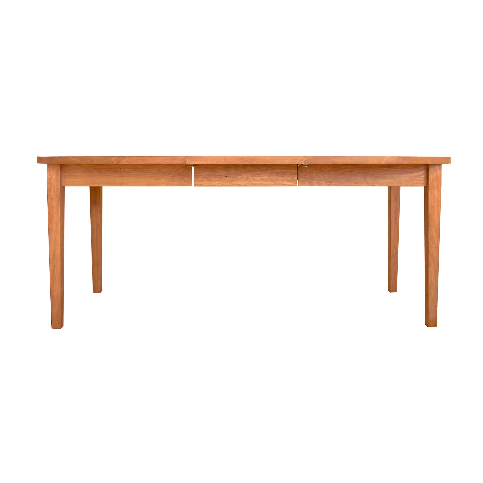 A Vermont Shaker Oval Extension Dining Table by Maple Corner Woodworks, with a simple wooden design and four legs, isolated on a clear white background.