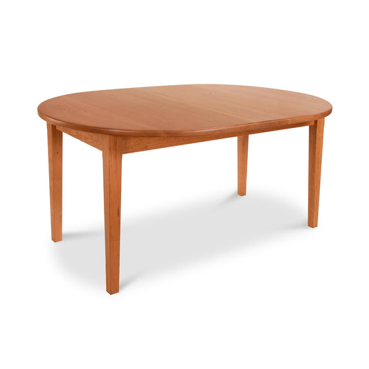Vermont Shaker Oval Solid Top Dining Table by Maple Corner Woodworks, crafted from sustainably harvested wood with four straight legs, showcasing classic elegance and embodying the Vermont Shaker Furniture Collection.
