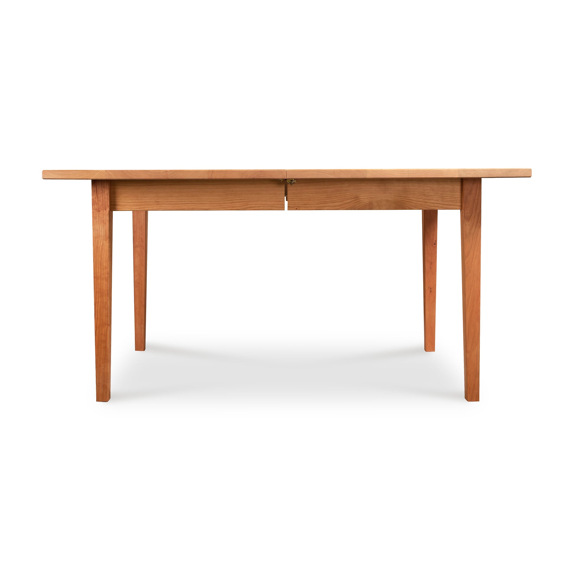 Vermont Shaker Rectangular Extension Dining Table by Maple Corner Woodworks, crafted from sustainably harvested wood, showcasing a simple design with four sturdy legs.