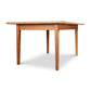 A Vermont Shaker Rectangular Extension Dining Table - Clearance by Maple Corner Woodworks, with four legs, isolated on a white background.