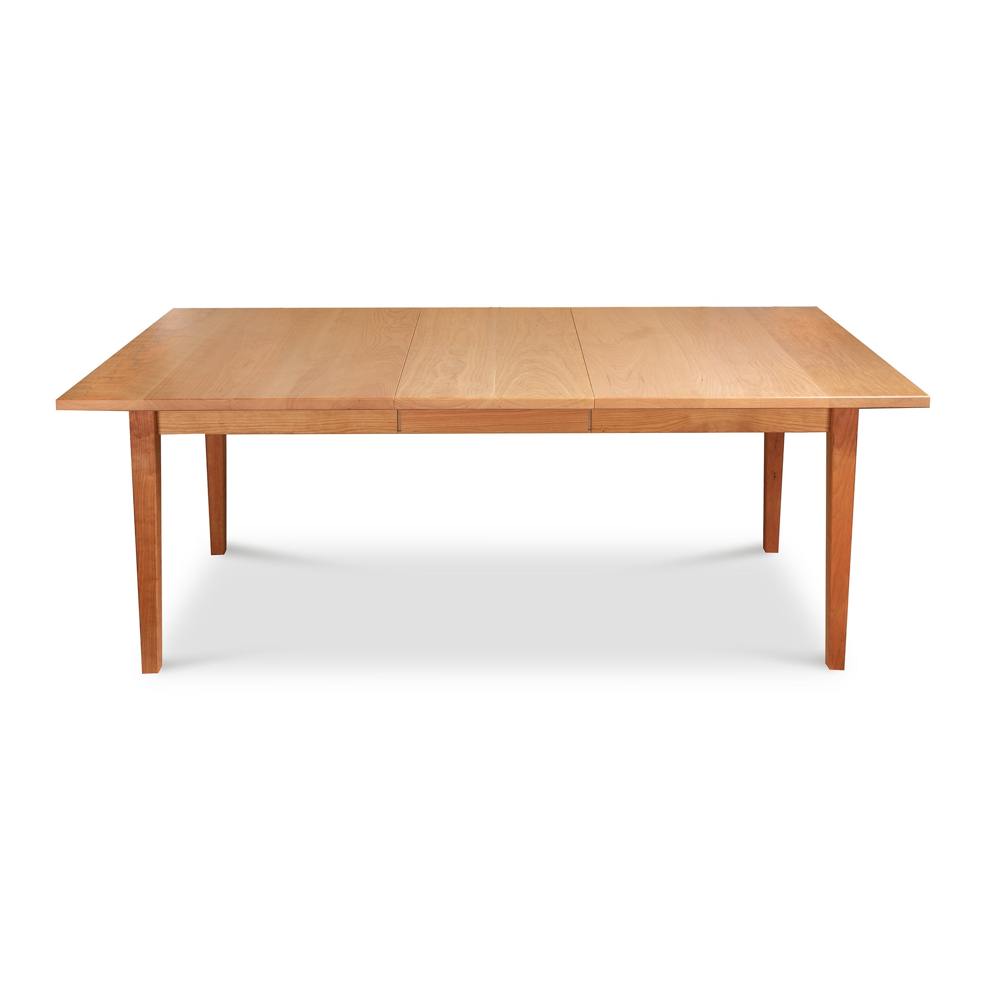 Vermont Shaker Rectangular Extension Dining Table by Maple Corner Woodworks with straight legs and a natural light wood finish crafted from sustainably harvested materials.