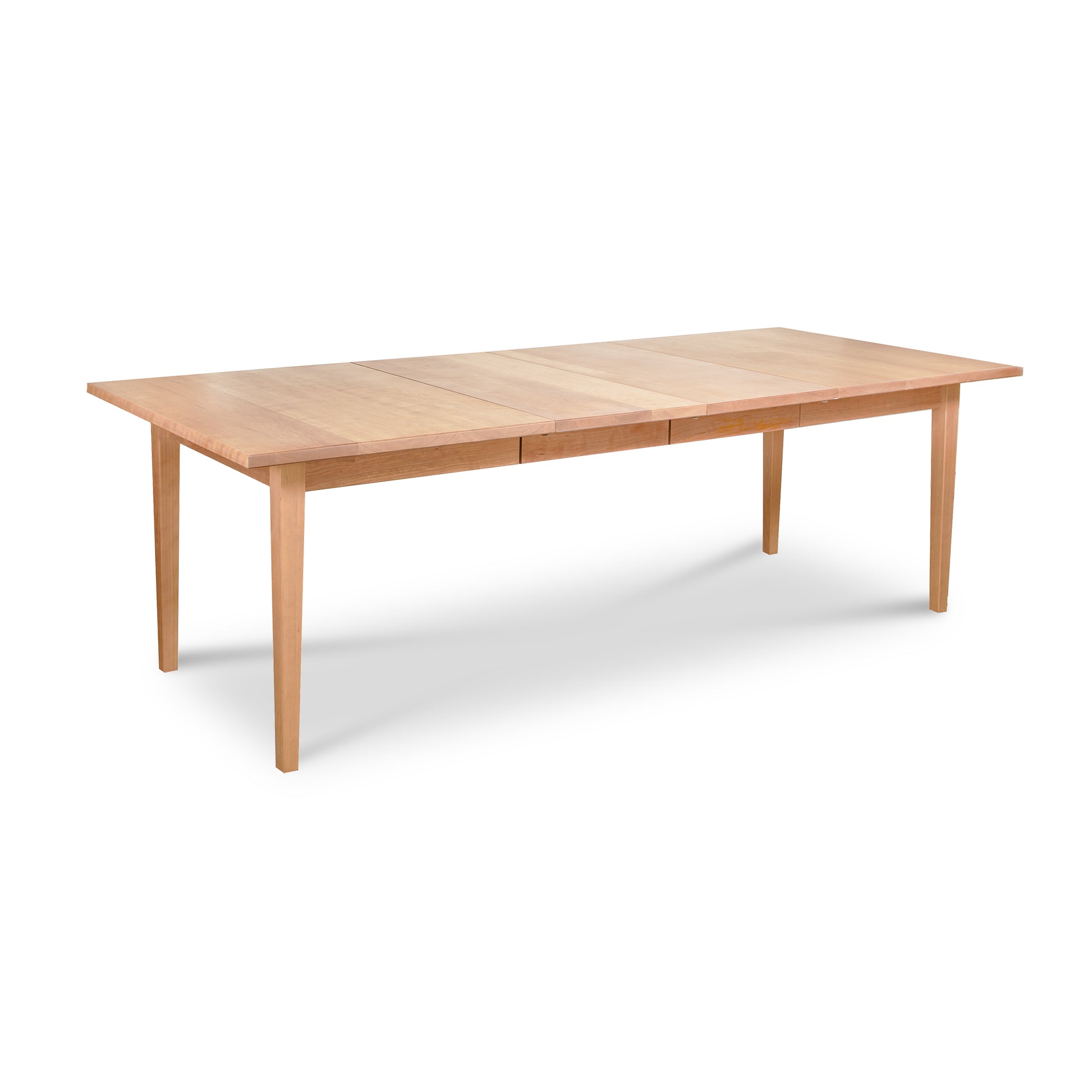 Vermont Shaker Rectangular Extension Dining Table by Maple Corner Woodworks in sustainably harvested wood with classic rectangular shape and four straight legs.