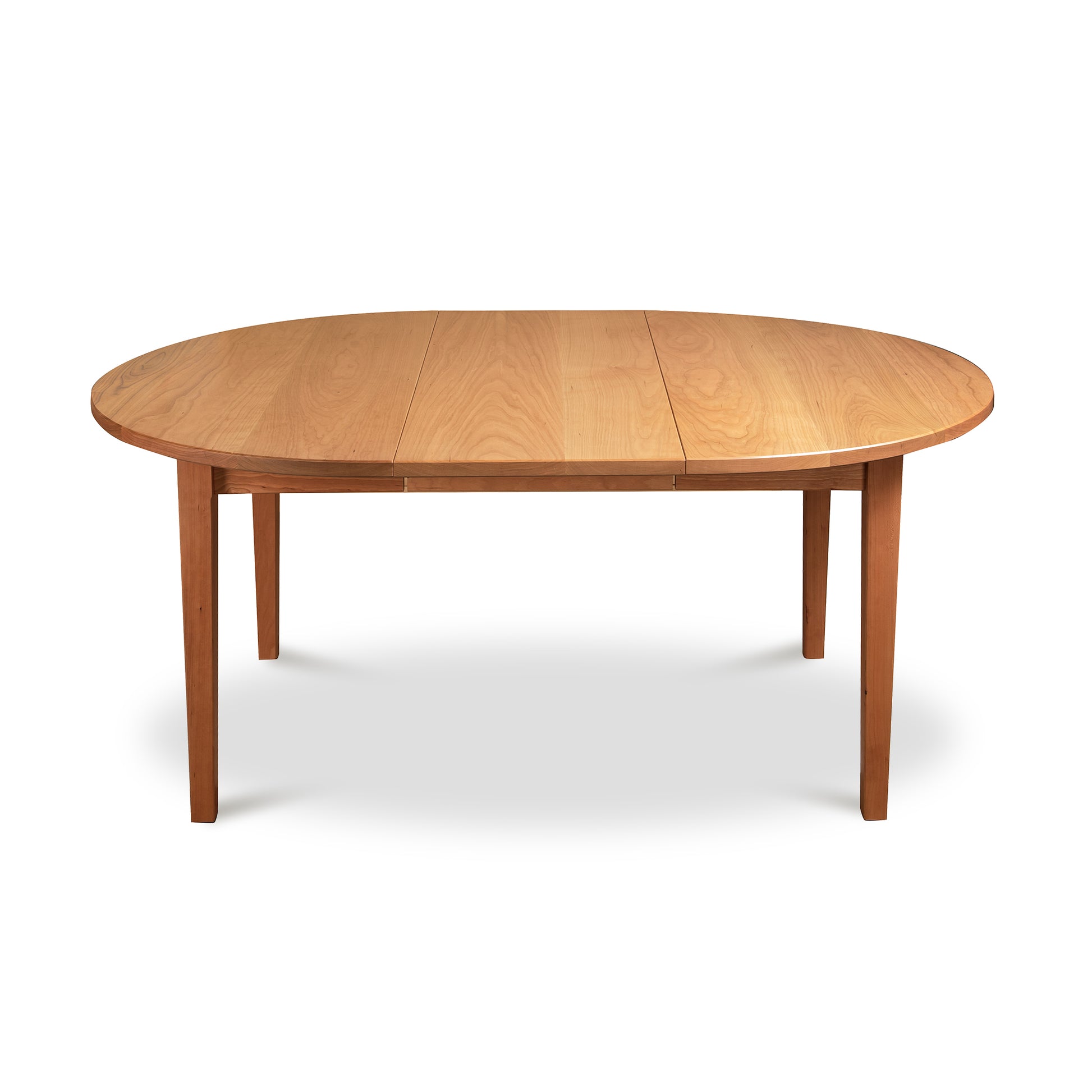 Vermont Shaker Round Extension Table, round wooden dining table with four legs and light brown finish, eco-friendly craftsmanship by Maple Corner Woodworks