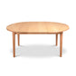 A light eco-friendly Vermont Shaker Round Extension Table with a smooth surface and simple, straight legs, isolated on a white background by Maple Corner Woodworks.