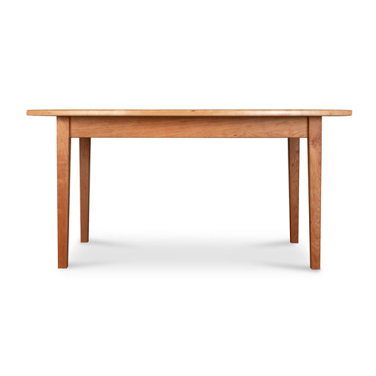 Maple Corner Woodworks Vermont Shaker boat-shaped solid top dining table featuring tapered legs.