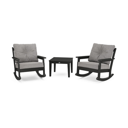Two Vineyard 3-Piece Deep Seating Rocker Set chairs, crafted from POLYWOOD lumber with gray cushions, are arranged facing each other with a small black side table placed between them, all set against a white background.