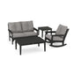 A modern POLYWOOD® Vineyard 4-Piece Deep Seating Rocker Set including a sofa, rocking chair, and two square tables, all in black frames with gray cushions, arranged on a white background.