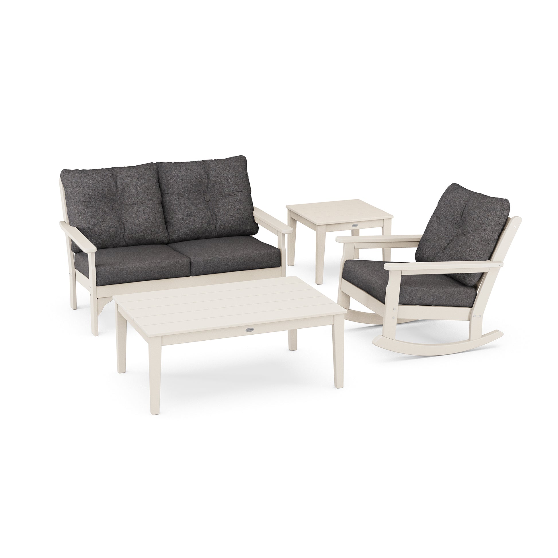 Outdoor furniture set including a sofa with gray cushions, two matching armchairs, and a rectangular coffee table from the POLYWOOD Vineyard 4-Piece Deep Seating Rocker Set.