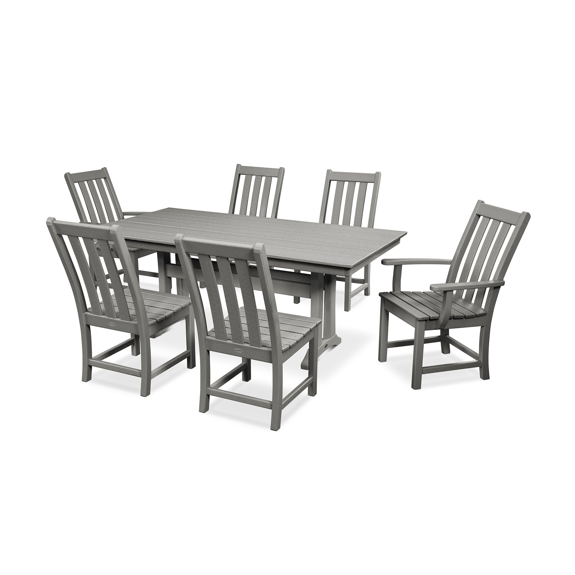 A modern outdoor dining set consisting of a POLYWOOD Vineyard 7-Piece Farmhouse Trestle Dining Set, which includes a large farmhouse trestle table and six matching chairs, all made of gray synthetic material, arranged on a white background.