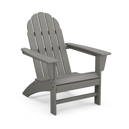 A gray POLYWOOD Vineyard Adirondack chair made of plastic, featuring a slatted back and seat design, with wide armrests, isolated on a white background.