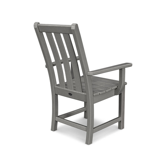 Stylish gray wooden POLYWOOD Vineyard Dining Arm Chair with vertical slats on the backrest and armrests.
