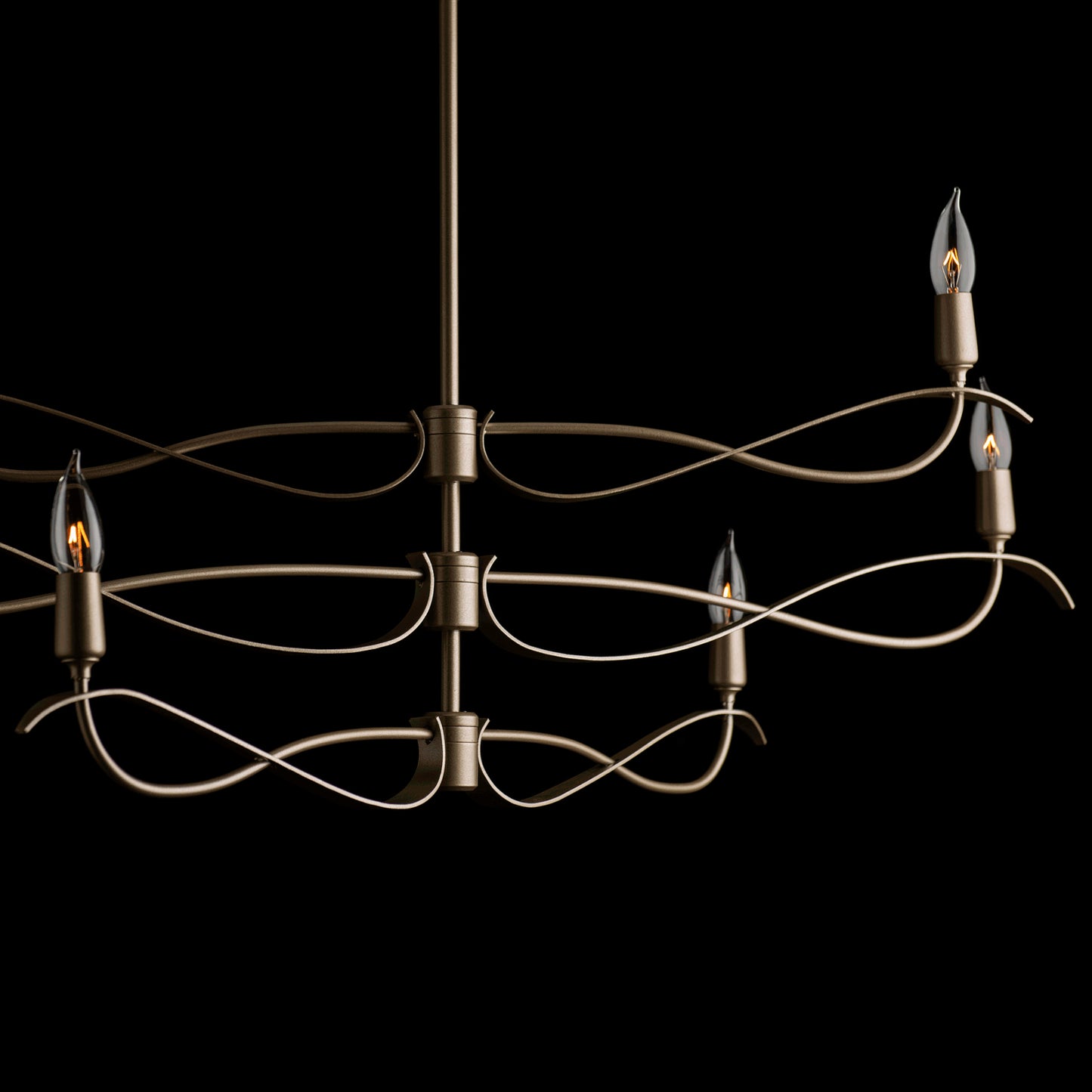Willow 6-Light Chandelier by Hubbardton Forge, showcasing a sleek modern design with handcrafted bronze curves and four elegant candle-shaped bulbs.