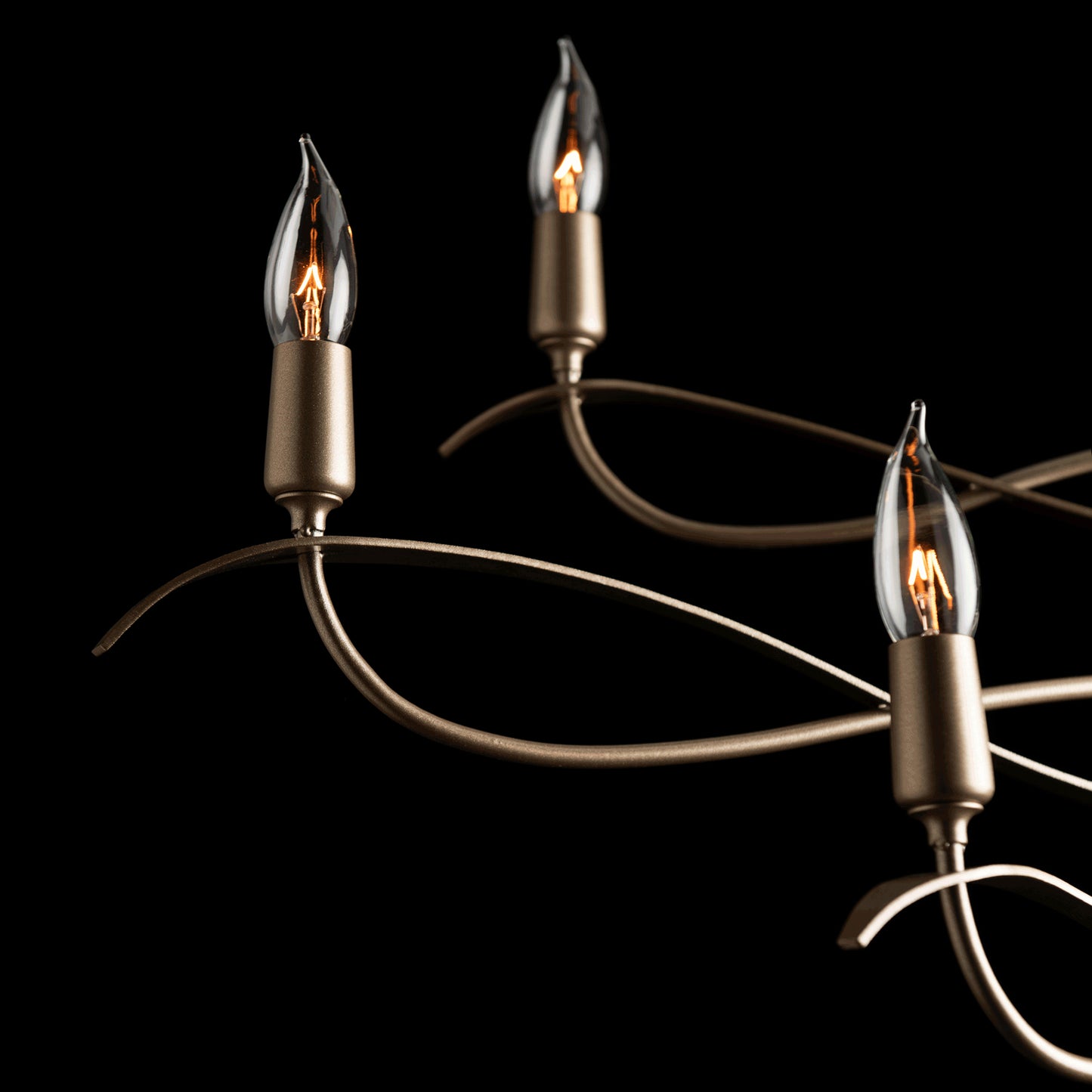 Willow 6-Light Small Chandelier by Hubbardton Forge with three candle-shaped bulbs and a bronze fixture.