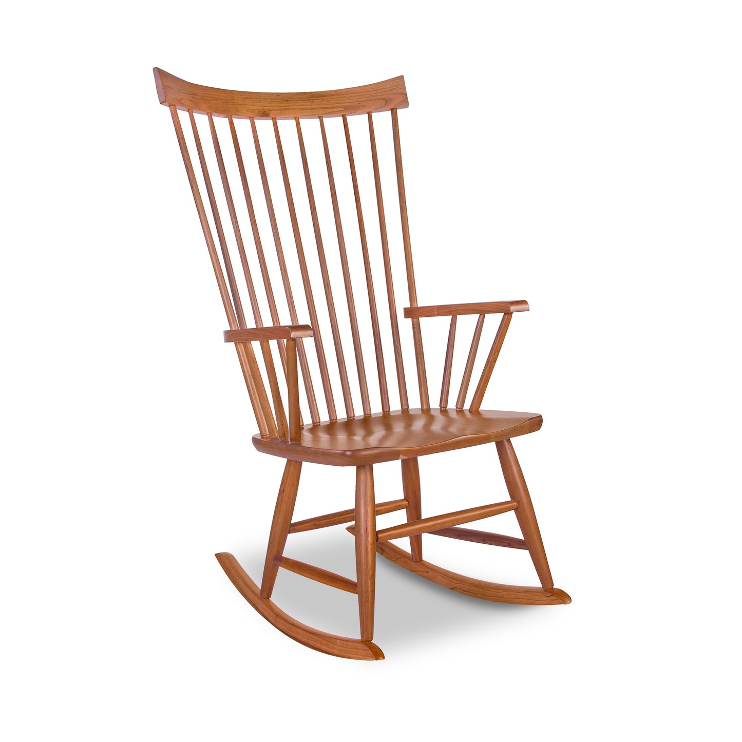 Lyndon Furniture Windsor Rocking Chair in cherry wood with vertical slats, curved rockers, and armrests—classic, elegant craftsmanship.