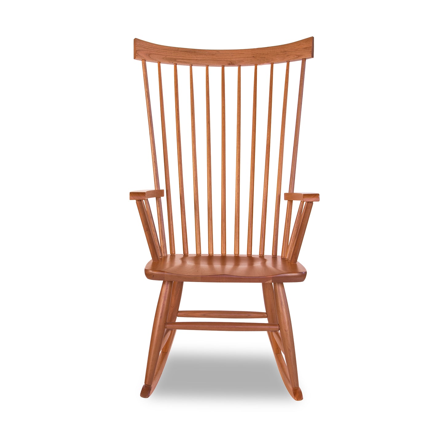 Lyndon Furniture Windsor Rocking Chair with vertical slats and curved rockers, crafted in solid wood, highlighting its classic design.