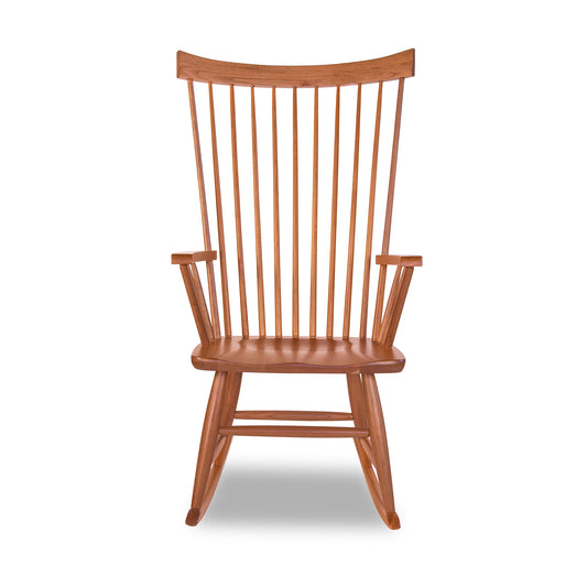 Lyndon Furniture Windsor Rocking Chair with vertical slats and curved rockers, crafted in solid wood, highlighting its classic design.