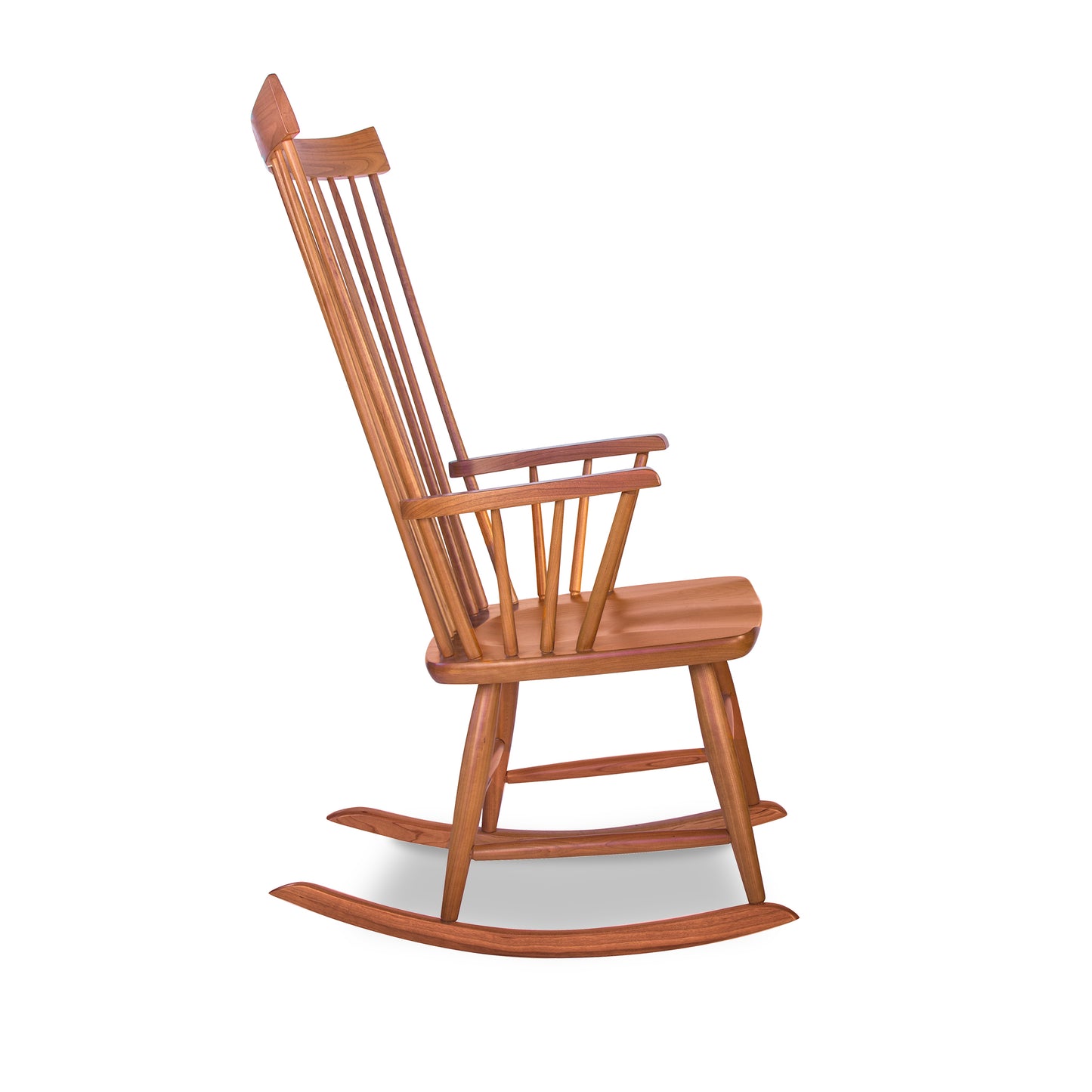 Lyndon Furniture Windsor Rocking Chair crafted from cherry wood with vertical slats, curved rockers, and armrests; showcases elegant American craftsmanship.