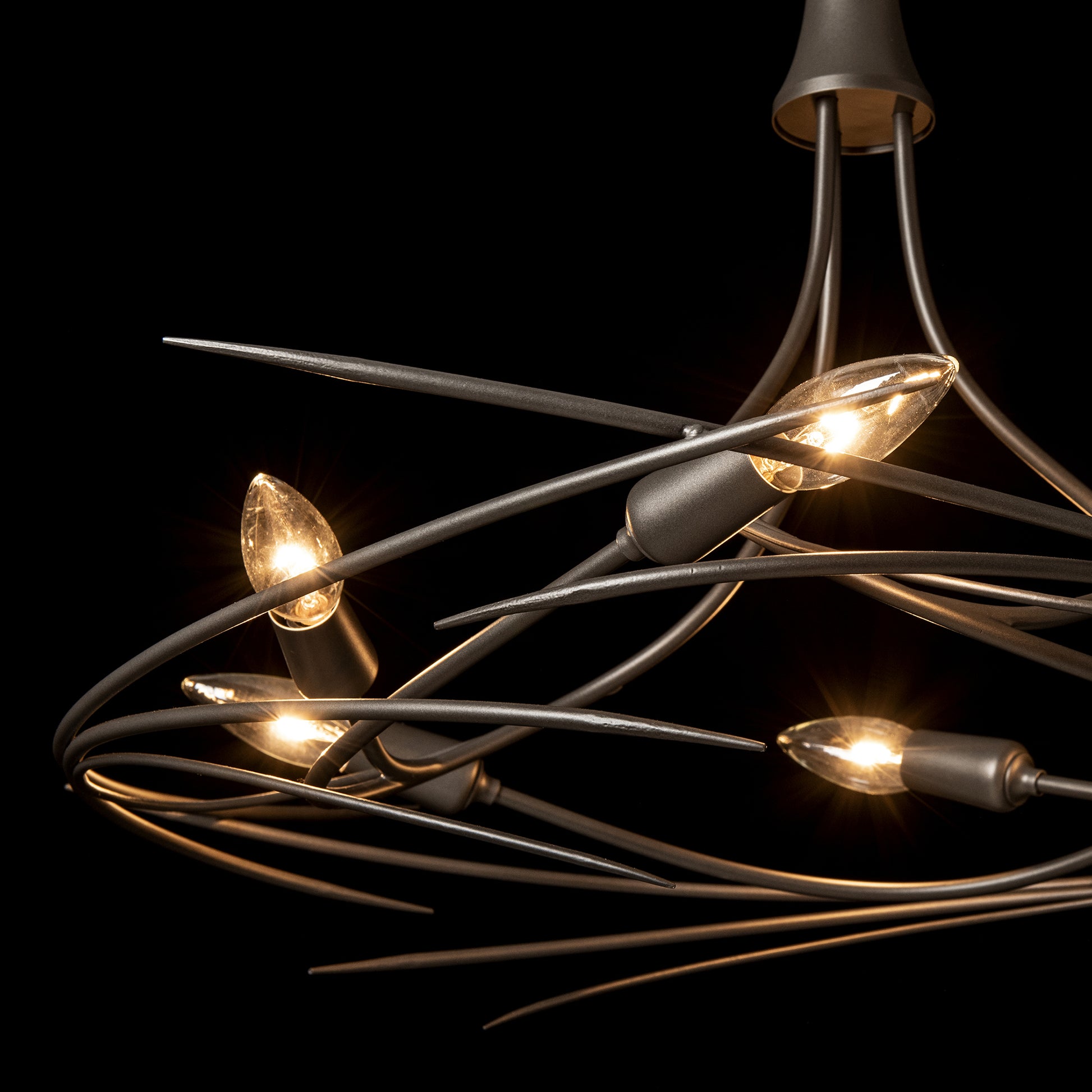 The Hubbardton Forge Wisp 6-Light Chandelier showcases an elegant silhouette with fine tailoring, featuring four lights.
