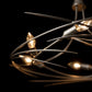 The Hubbardton Forge Wisp 6-Light Chandelier showcases an elegant silhouette with its fine tailoring, featuring stunning lights that beautifully illuminate any space.
