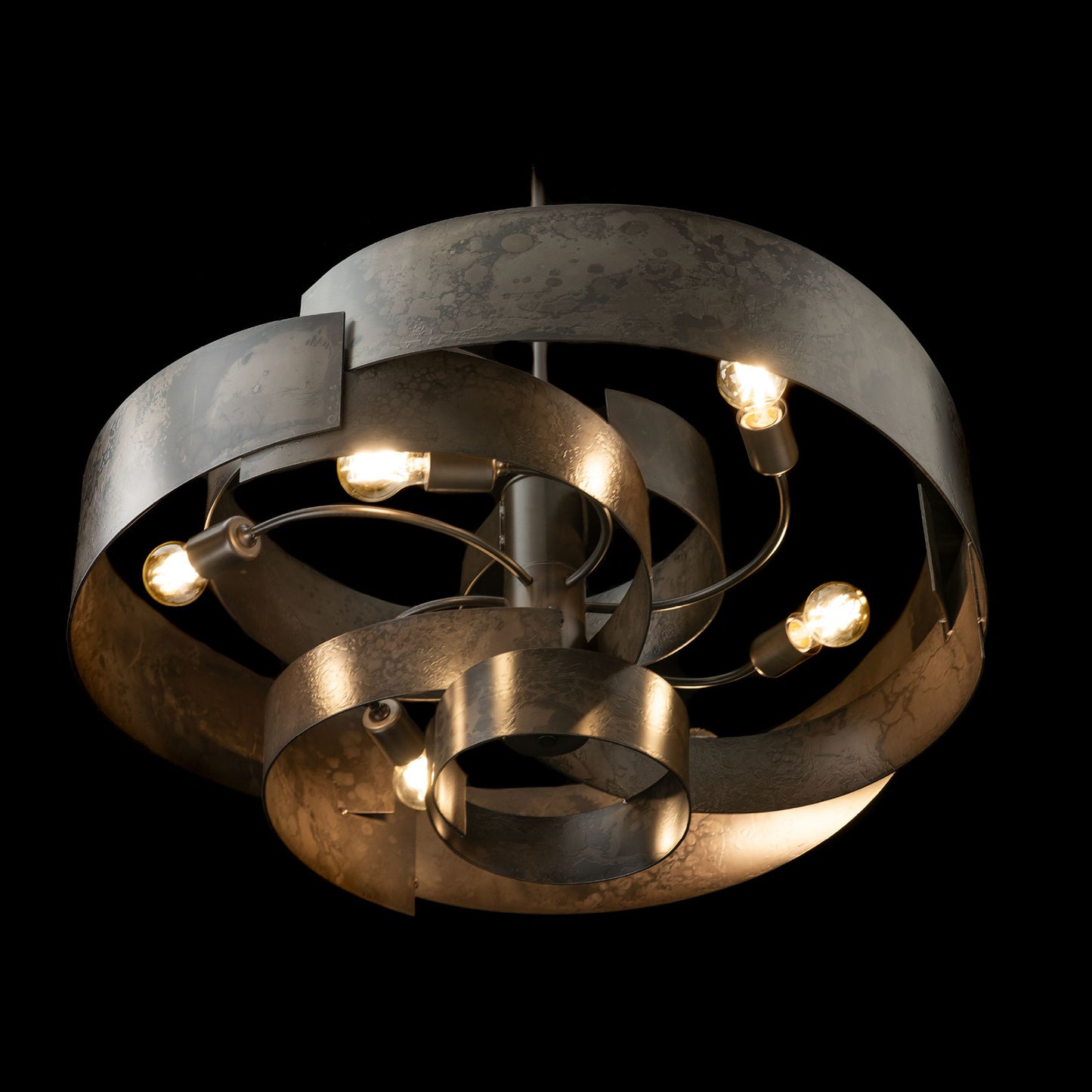Zen Pendant light with elegantly handcrafted curves and exposed bulbs, showcasing a modern black finish and artisan craftsmanship by Hubbardton Forge.