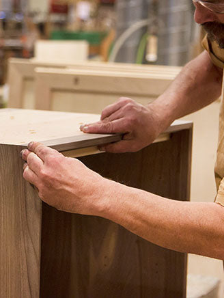 A man working on a piece of wood.
