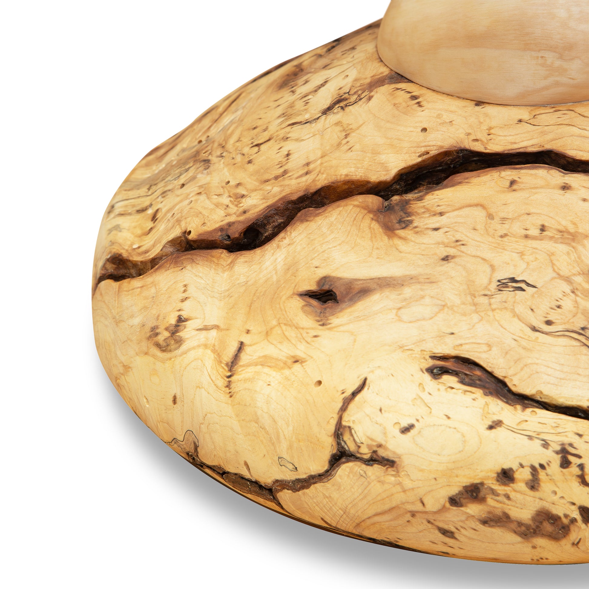 Creemee Artisan Table by David Holzapfel, highlighting its smooth curves, unique natural cracks, and prominent wood grain.