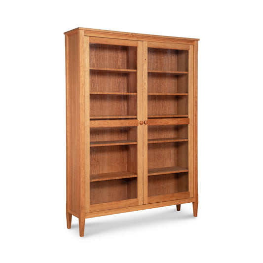 Custom Vermont Shaker bookcase with glass doors, handcrafted from sustainable hardwoods by Maple Corner Woodworks.