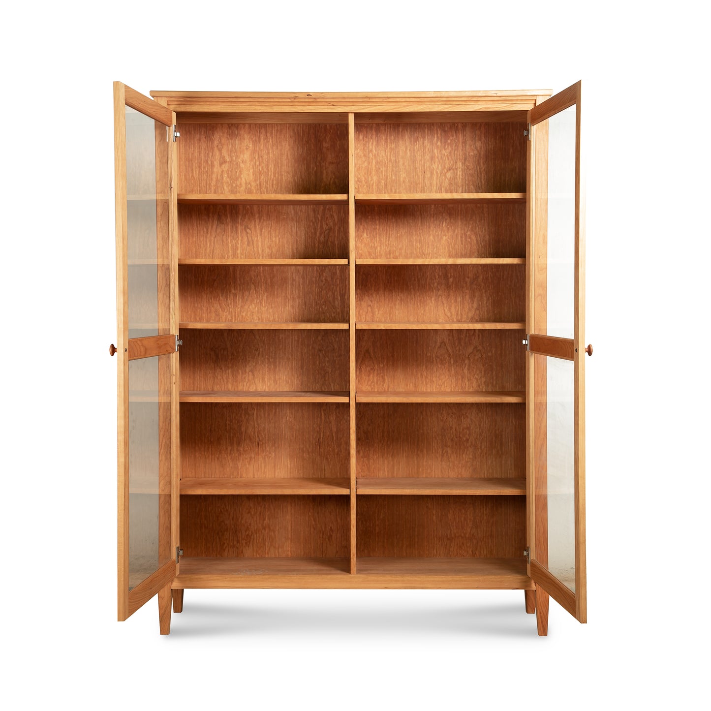 Custom Vermont Shaker Bookcase with Glass Doors by Maple Corner Woodworks, showcasing its spacious wooden shelves and elegant craftsmanship.