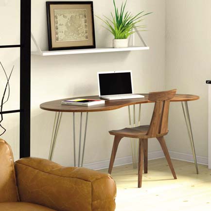 A living room with a brown couch and a wooden desk.