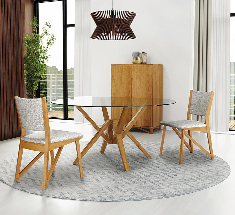 Copeland's Exeter Round Glass Top Dining Table with a Natural Cherry base and matching chairs