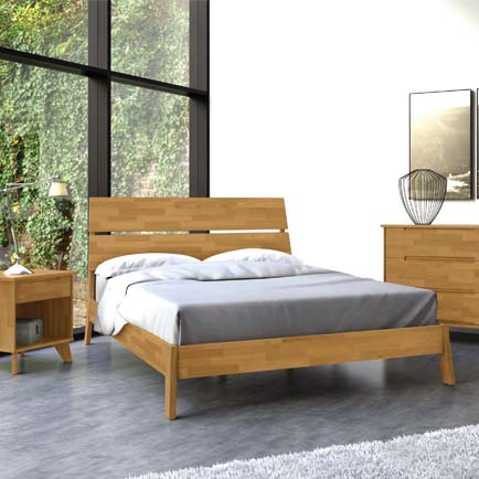 A bedroom with a wooden bed, dresser and nightstand.