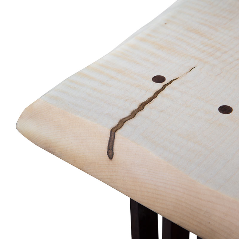 A piece of wood with a hole in it.