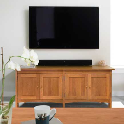 A living room with a tv and a coffee table.
