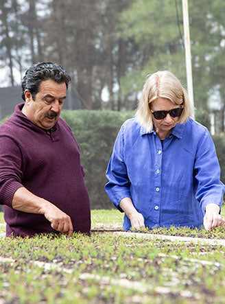 A woman wearing a blue shirt.
