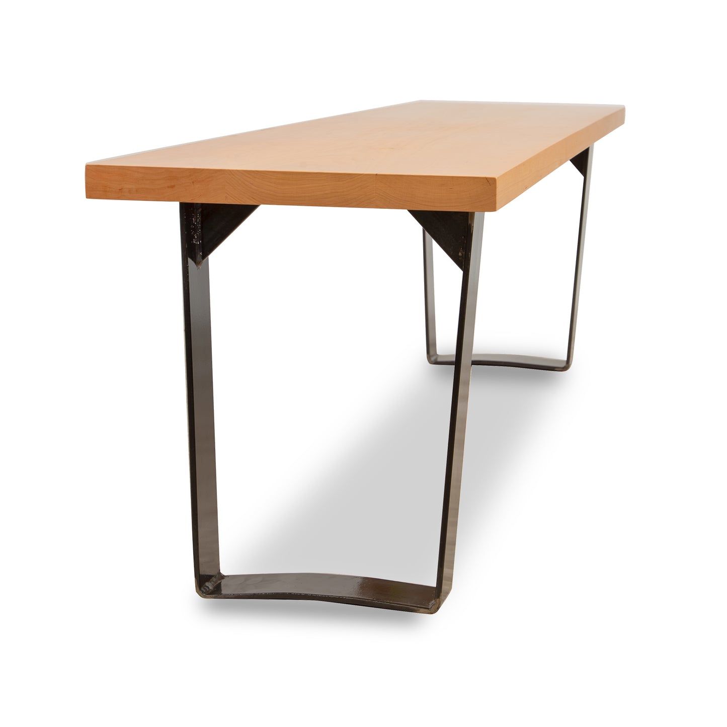 A table with a wooden top and metal legs.