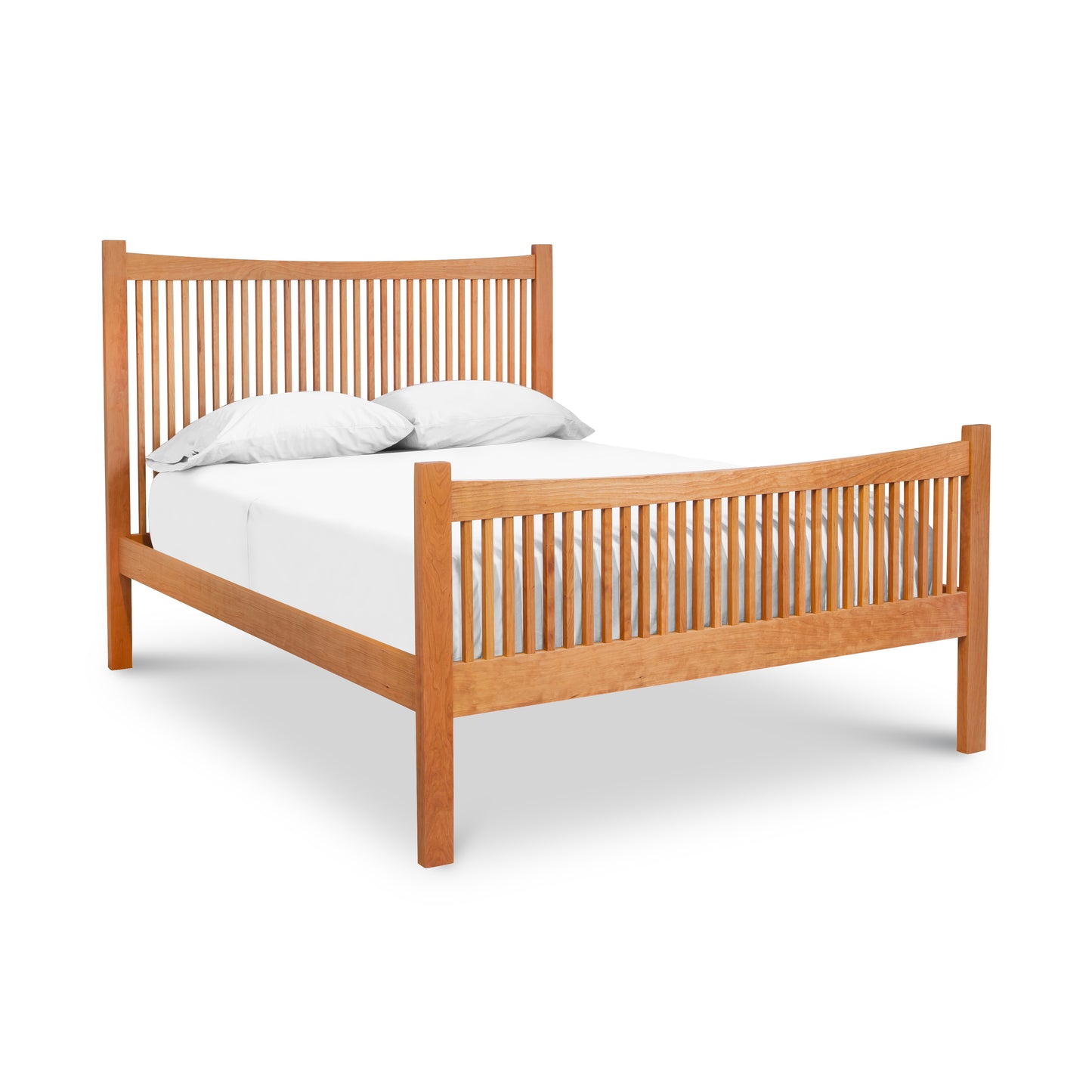 A wooden bed with a white sheet on it.