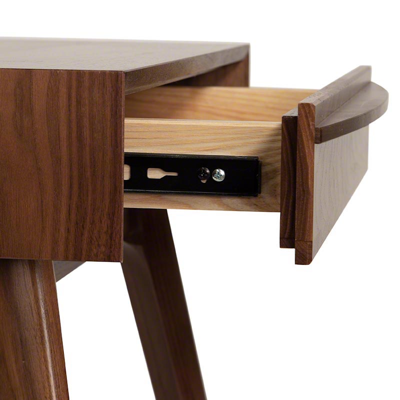 A wooden desk with a drawer on it.