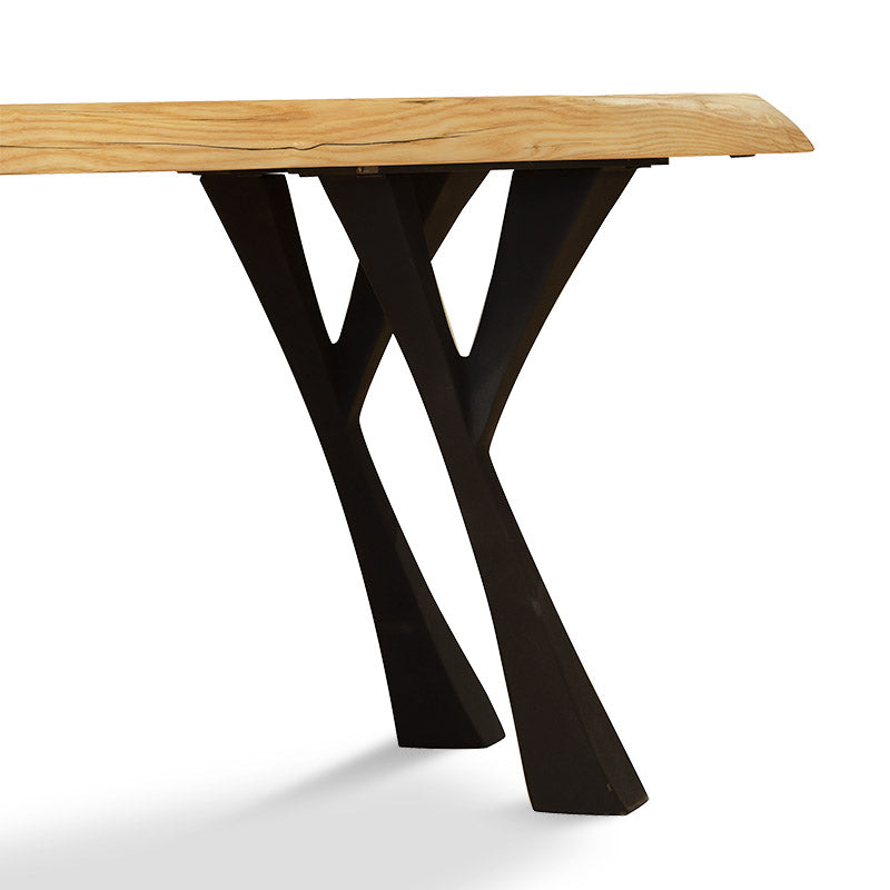 A table with a black base and a wooden top.