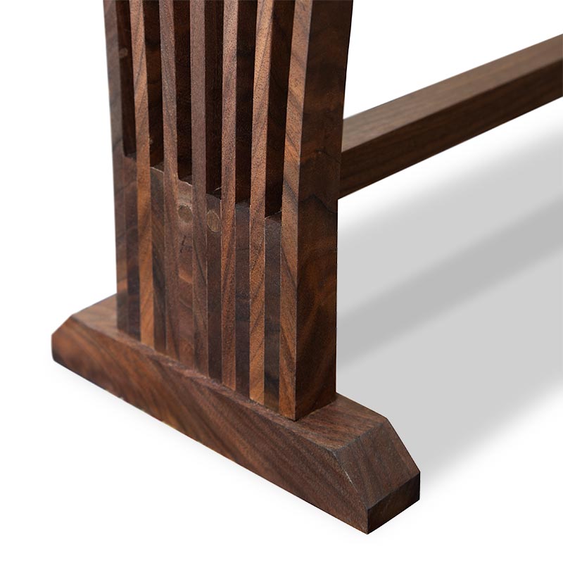 A close up view of a wooden bench.