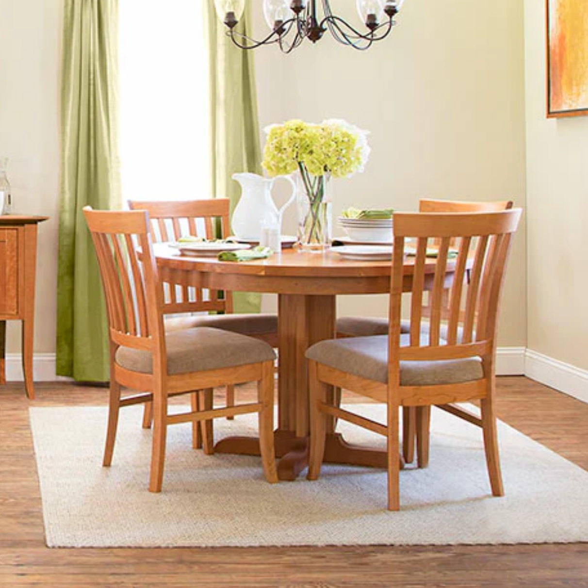 Round pedestal dining table in cherry