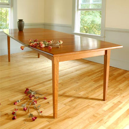 A wooden table in a room.