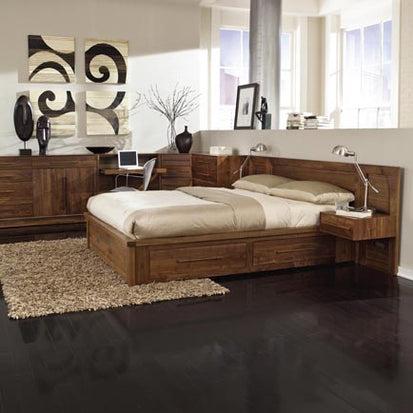 A bedroom with a wooden bed and dresser.