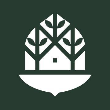 A white logo with a tree in the shape of a house.