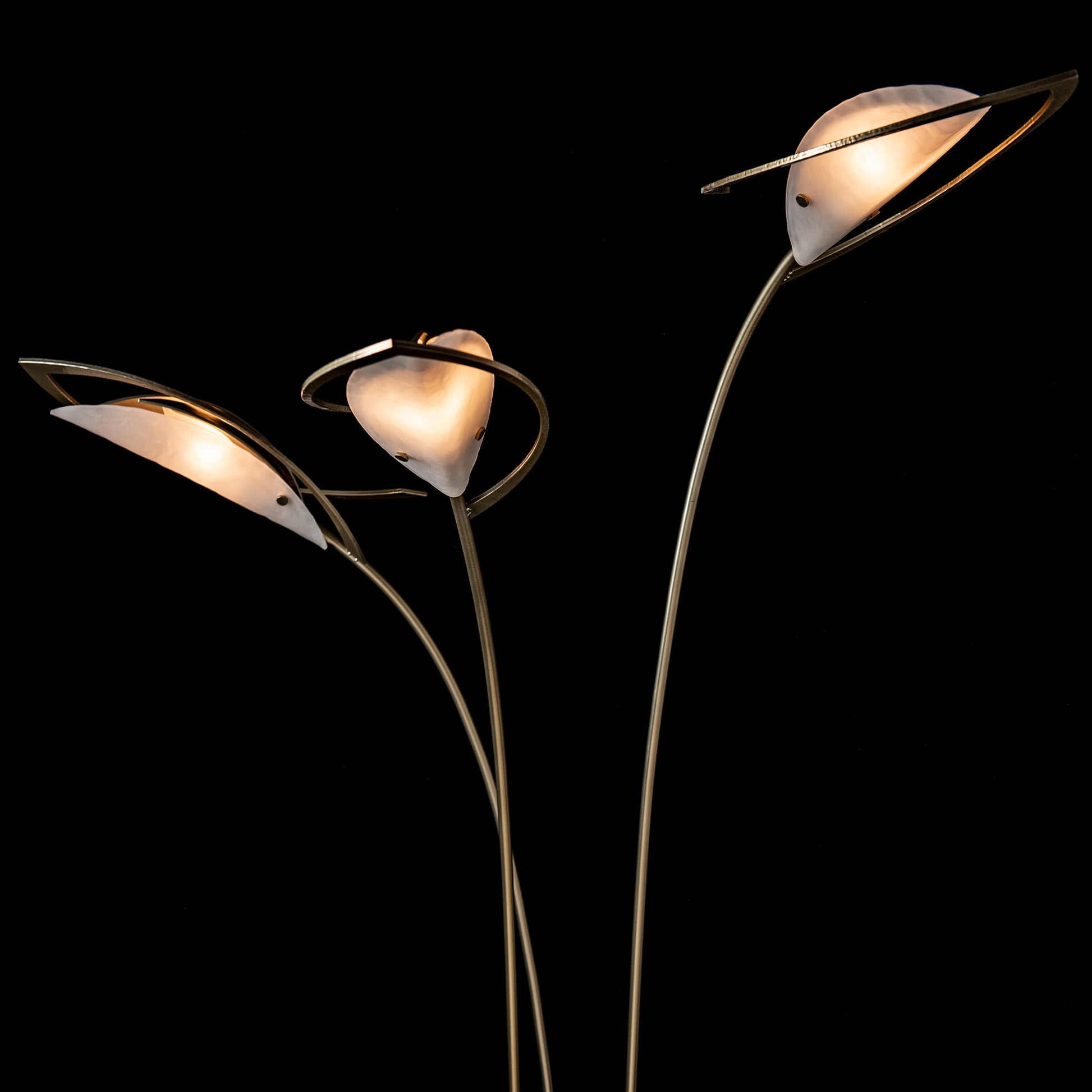 Three Hubbardton Forge Aerial Torchiere floor lamps with modern brass finish and white tulip shades, showcasing quality American craftsmanship.