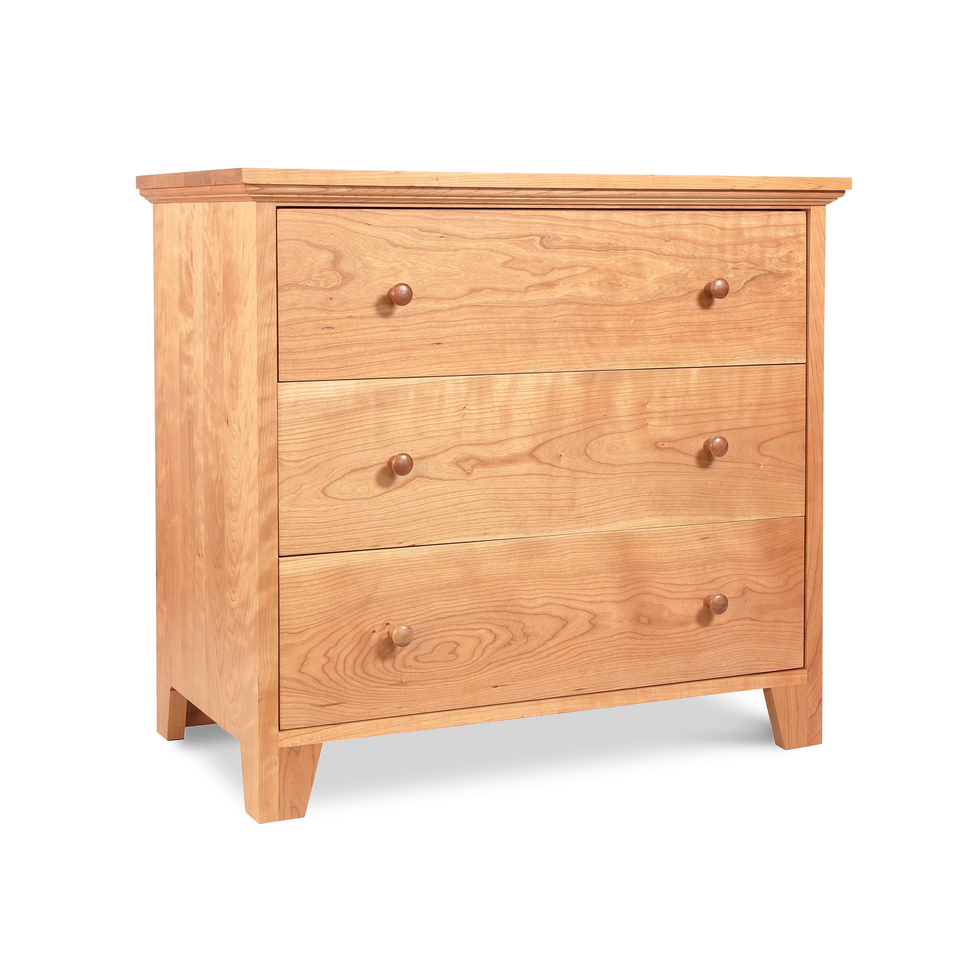 A wooden American Country 3-Drawer Chest handmade by Lyndon Furniture in Vermont with a natural cherry finish, displayed on a white background.