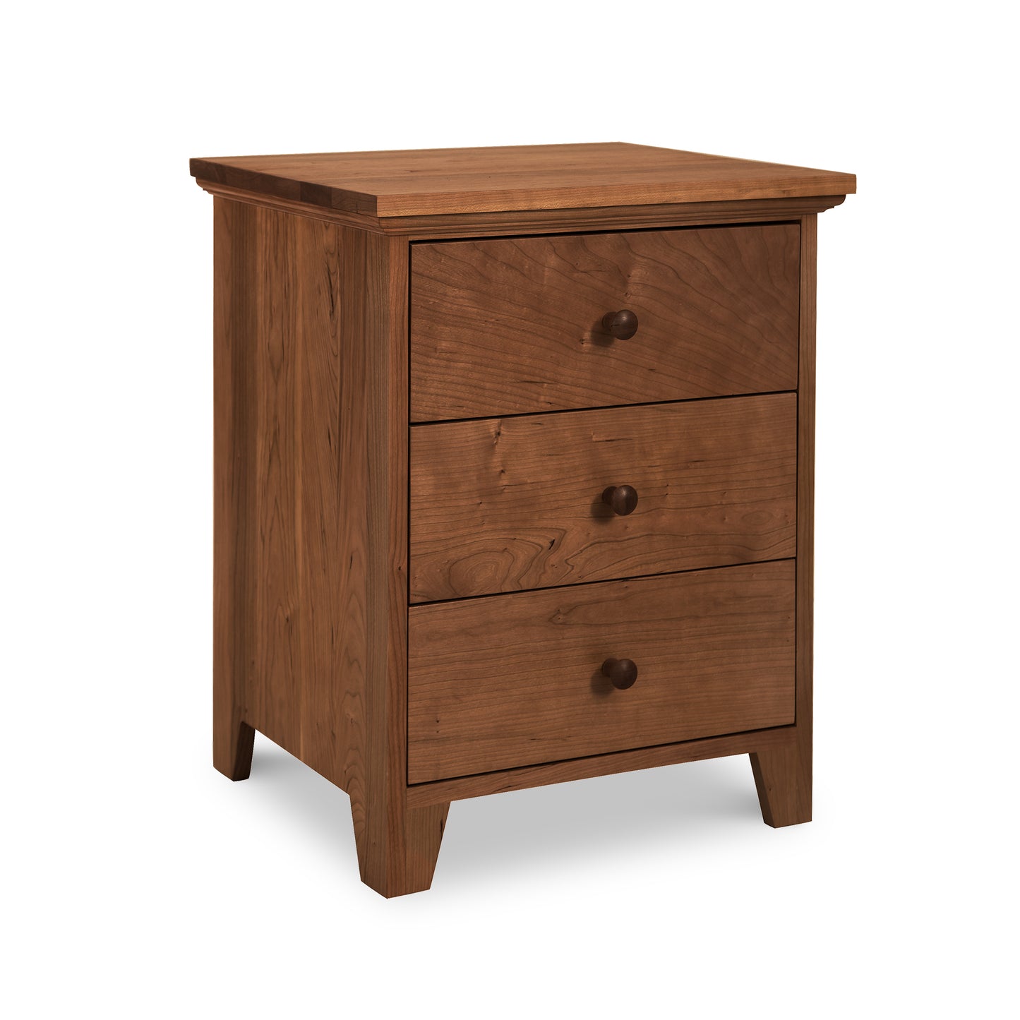 Natural finish handcrafted solid wood American Country 3-Drawer Nightstand by Lyndon Furniture with decorative knobs.