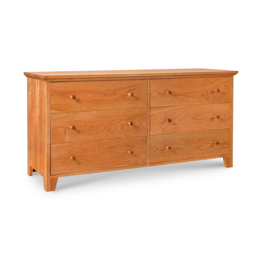 A Lyndon Furniture American Country 6-Drawer Dresser - Floor Model with a simple, classic design, featuring round wooden knobs on each drawer, standing against a white background.